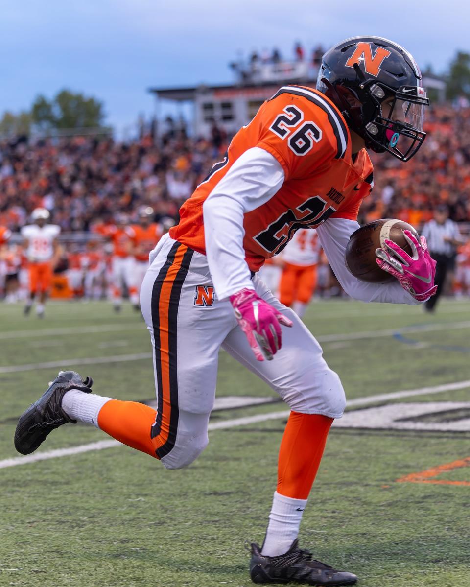 Angelo Rodriguez scores Northville's first touchdown on a 28-yard catch in a 17-14 loss to Brighton on Friday, Sept. 23, 2022.