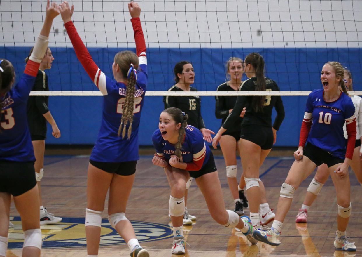 Fairport players celebrate after the final point giving them the victory over Rush-Henrietta during their Section V Class AAA volleyball final.