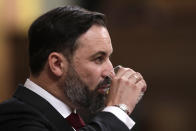 Vox party leader Santiago Abascal pauses to drink a glass of water while making a speech during a parliamentary session in Madrid, Spain, Wednesday Oct. 21, 2020. Spanish Prime Minister Pedro Sanchez faces a no confidence vote in Parliament put forth by the far right opposition party VOX. (AP Photo/Manu Fernandez, Pool)