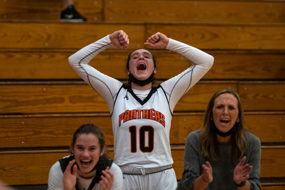 Claire McDougall cheers for her team during a home game against Dunlap on Dec. 10, 2021. The Washington Panthers beat the Eagles 48-31.