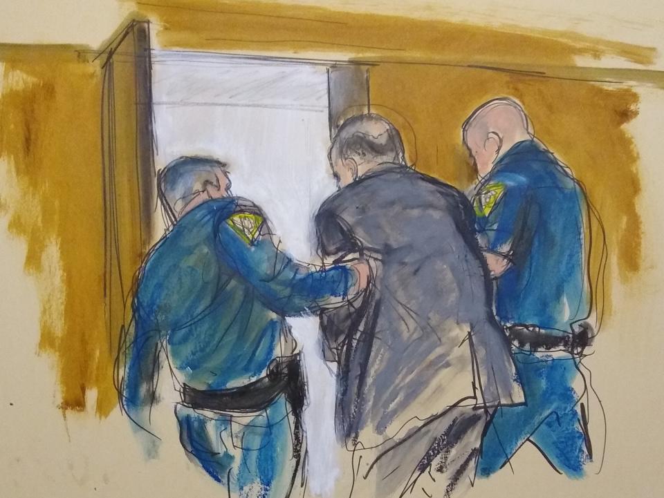 In this courtroom sketch, Harvey Weinstein, center, is led out of Manhattan Supreme Court by court officers after a jury convicted him of rape and sexual assault, Monday, Feb. 24, 2020 in New York. The jury found him not guilty of the most serious charge, predatory sexual assault, which could have resulted in a life sentence in New York. (Elizabeth Williams via AP)