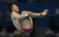 Wang Zongyuan of China competes in men's diving 3m springboard final at the Tokyo Aquatics Centre at the 2020 Summer Olympics, Tuesday, Aug. 3, 2021, in Tokyo, Japan. (AP Photo/Dmitri Lovetsky)