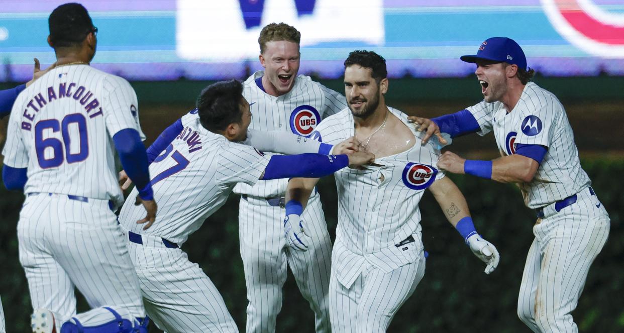 Aug 1, 2024; Chicago, Illinois, USA; Chicago Cubs outfielder Mike Tauchman (40) celebrates with teammates his walk-off single against the St. Louis Cardinals during the ninth inning at Wrigley Field. Mandatory Credit: Kamil Krzaczynski-USA TODAY Sports