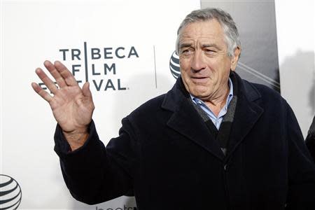 Robert De Niro waves upon arriving for the 2014 Tribeca Film Festival opening night screening of 'Time Is Illmatic' in New York April 16, 2014. REUTERS/Shannon Stapleton