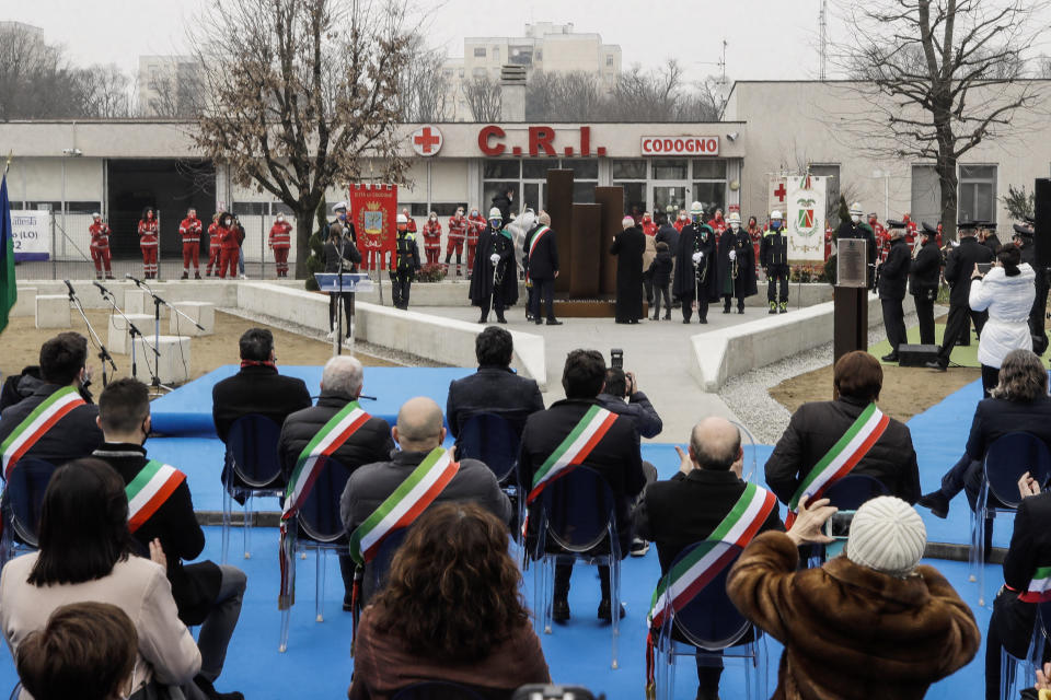 Authorities unveil a memorial for Covid deaths, in Codogno, northern Italy, Sunday, Feb. 21, 2021. The first case of locally spread COVID-19 in Europe was found in the small town of Codogno, Italy one year ago on February 21st, 2020. The next day the area became a red zone, locked down and cutoff from the rest of Italy with soldiers standing at roadblocks keeping anyone from entering of leaving. (AP Photo/Luca Bruno)