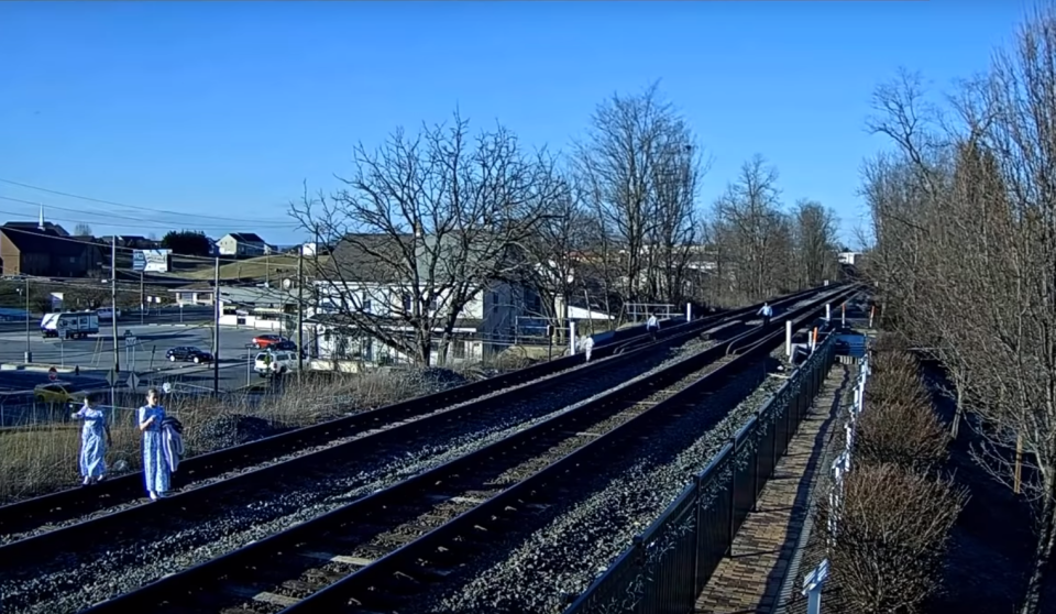 Family nearly hit by train while taking photos on rail tracks: Virtual Railfan