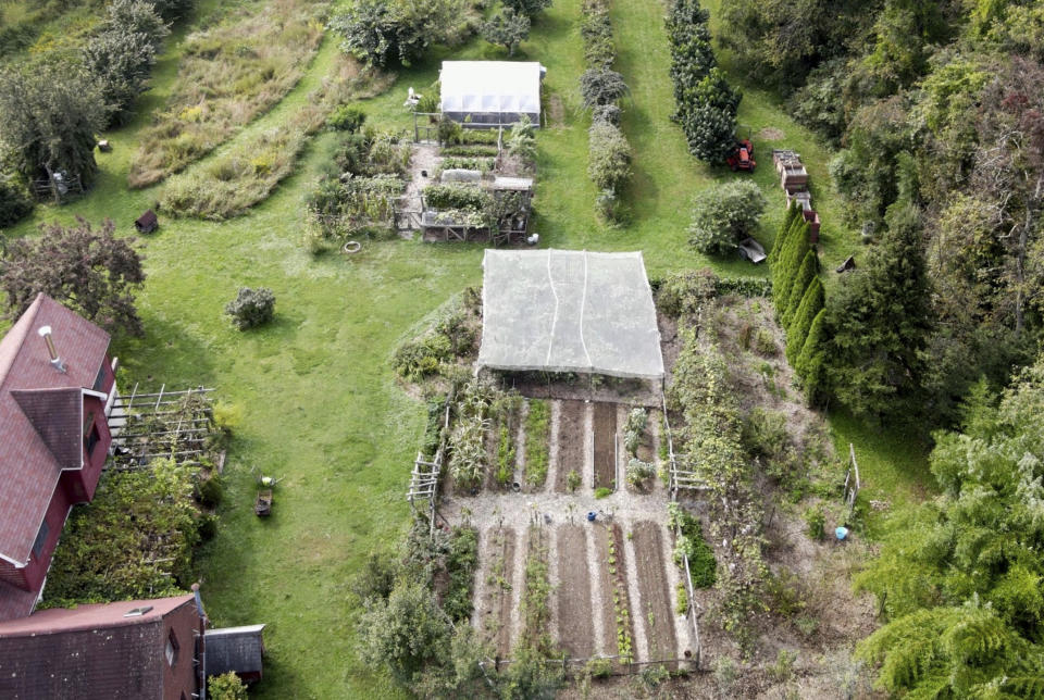 This undated photo shows the garden of writer Lee Reich in New Paltz, NY. A mixed garden of vegetables, flowers, herbs and fruits can please all the senses. (Lee Reich via AP)