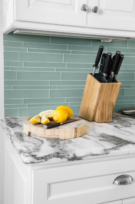 Elongated rectangular tiles have a stretching effect and can make your kitchen appear longer. Stick to a light colour scheme to keep the room feeling open.