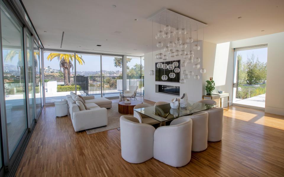 white chairs in a room at mansion The One Bel Air