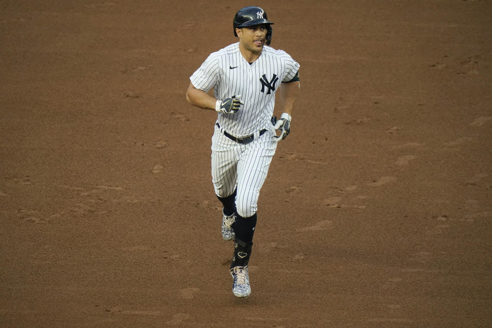 New York Yankees' Giancarlo Stanton runs the bases after hitting a two-run home run during the first inning of a baseball game against the Houston Astros Tuesday, May 4, 2021, in New York. (AP Photo/Frank Franklin II)