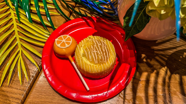 Starbucks orange pop and pineapple cake on plate