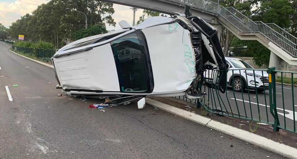 A Toyota Prado seen impaled on railing at Elizabeth Drive at Bonnyrigg after it was allegedly crashed by a learner driver.