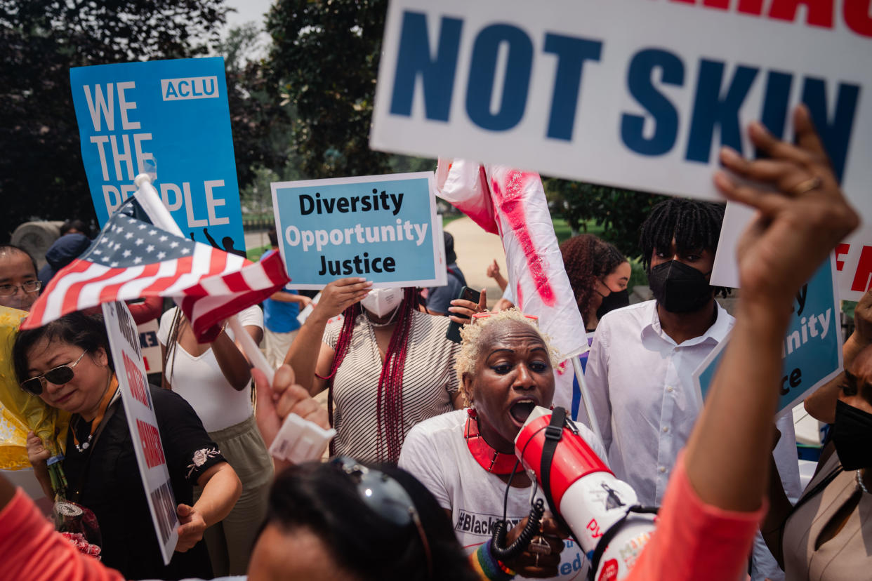 Affirmative action supporters and and counterprotesters shout at each other outside the Supreme Court on June 29.