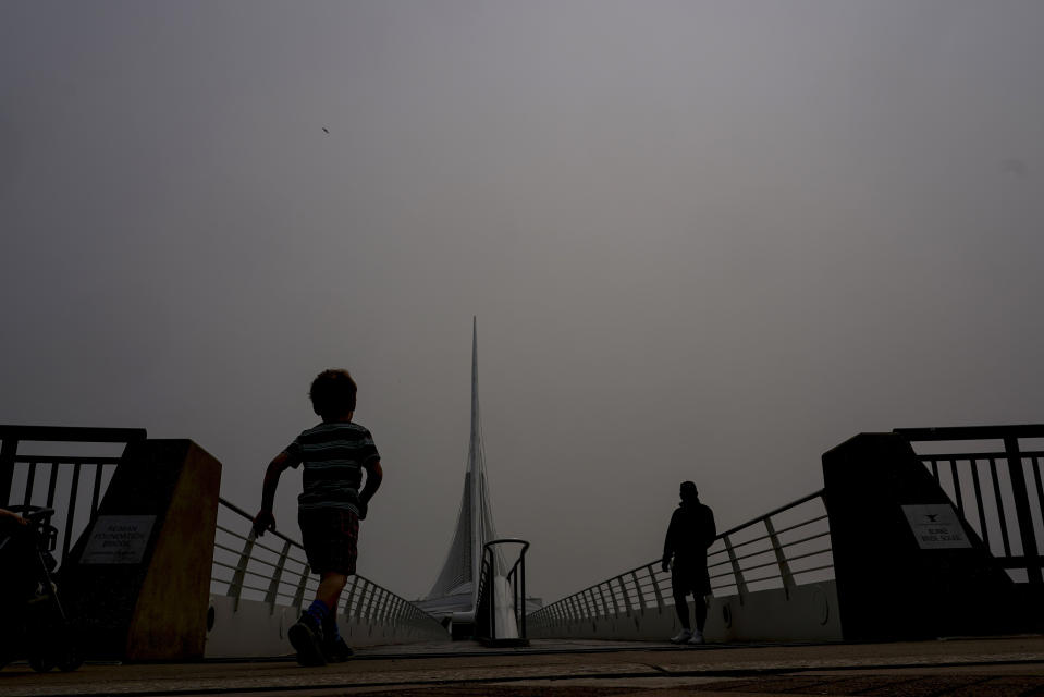 A haze is seen over the Milwaukee Art Museum Tuesday, June 27, 2023, in Milwaukee. The haze from Canadian wildfires, which, along with higher ozone levels is continuing to create low visibility conditions and lead to Air Quality Alerts throughout the area. (AP Photo/Morry Gash)