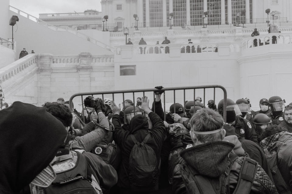 Pro-Trump rioters attempt to move a barricade outside of the Capitol.<span class="copyright">Christopher Lee for TIME</span>