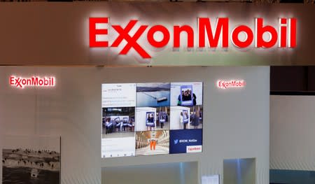 FILE PHOTO: Logos of ExxonMobil are seen in its booth at Gastech, the world's biggest expo for the gas industry, in Chiba