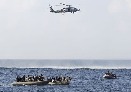 Visit, board, search and seizure (VBSS) team members from the guided-missile cruiser USS Vella Gulf (CG 72) close in on rigid-hulled inflatable boats to apprehend suspected pirates in Gulf of Aden in the Arabian Sea, in this February 12, 2009 file photo. REUTERS/Jason R. Zalasky/U.S. Navy photo/Handout