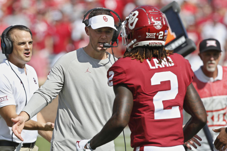 Oklahoma head coach Lincoln Riley greets wide receiver CeeDee Lamb (2) following a touchdown in the second quarter of an NCAA college football game against Texas Tech in Norman, Okla., Saturday, Sept. 28, 2019. (AP Photo/Sue Ogrocki)
