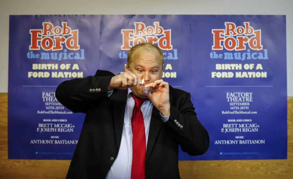 Geoff Stone poses for a picture as he pretends to smoke from a pipe following his audition for "Rob Ford The Musical: The Birth of a Ford Nation" in Toronto, June 16, 2014. Toronto Mayor Rob Ford, who shot to prominence last year after admitting to smoking crack, buying illegal drugs and driving after drinking, insisted for months he did not have a problem. But last month he said he would take time off to deal with his drinking issues. REUTERS/Mark Blinch (CANADA - Tags: POLITICS SOCIETY ENTERTAINMENT)