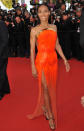 <b>Who:</b> Jada Pinkett-Smith <br> <b>What:</b> Atelier Versace gown <br> <b>Where:</b> Madagascar 3 premiere <br> <b>Why We Love It:</b> Jada Pinkett-Smith came to Cannes with her style guns blazing. Her looks included a retro-futurist Paco Rabanne with pointed shoulders, a studded Versace mini-dress, and a nearly see-through gown (during the day). The high-point of this tough-sexy line-up was the safety-orange Versace with a de rigueur thigh-high slit. The strapless bodice, outlined in gold, showed of Pinkett-Smith's toned shoulders and stick-straight hairdo was slicked back just enough to peep her undercut. Photo by Keystone Press<br><br><b>More on Flare:</b><br><br><a href="http://www.flare.com/blog/post/62815--a-canadian-affair-at-the-i-cosmopolis-i-photocall-in-cannes%20" rel="nofollow noopener" target="_blank" data-ylk="slk:A Canadian affair at the Cosmopolis photocall in Cannes;elm:context_link;itc:0;sec:content-canvas" class="link ">A Canadian affair at the Cosmopolis photocall in Cannes</a>