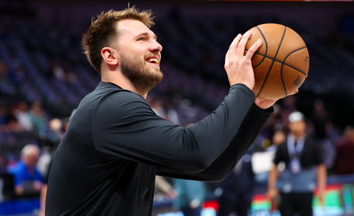 Dallas Mavericks guard Luka Doncic (77) warms up before a game against the Phoenix Suns at American Airlines Center.
