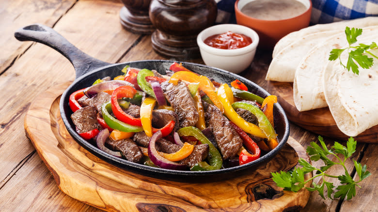 steak fajitas on skillet