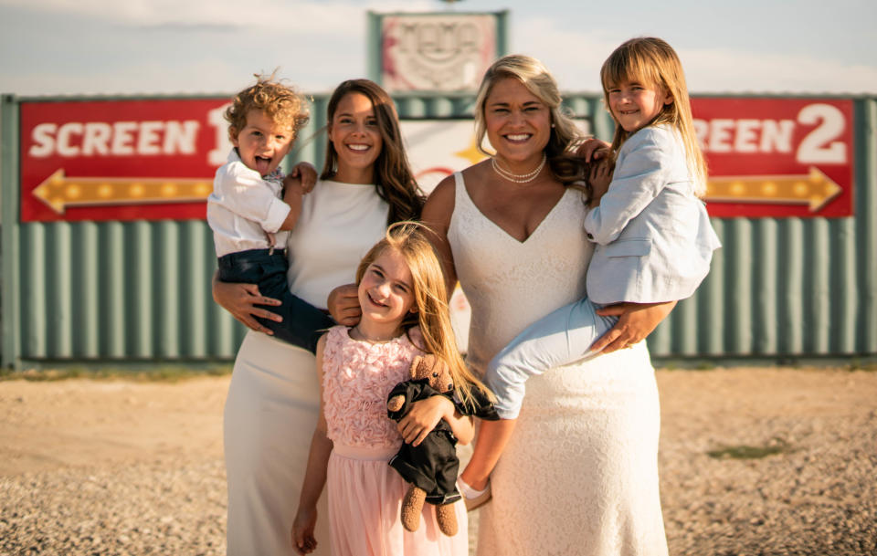 Bri and Lindsey Leaverton, center, with their children at Doc's Drive-In in Buda, Texas. | David Wells