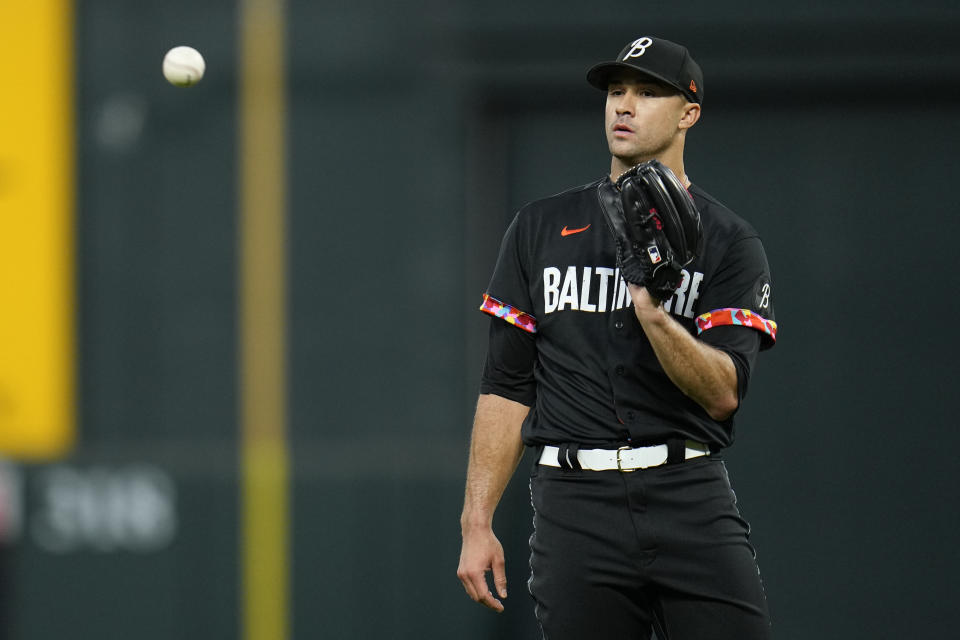 Baltimore Orioles starting pitcher Jack Flaherty waits for a ball between batters in the first inning of a baseball game against the Tampa Bay Rays, Friday, Sept. 15, 2023, in Baltimore. (AP Photo/Julio Cortez)