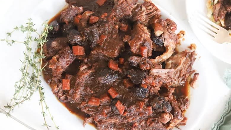 Top-down view of herb and fig pot roast