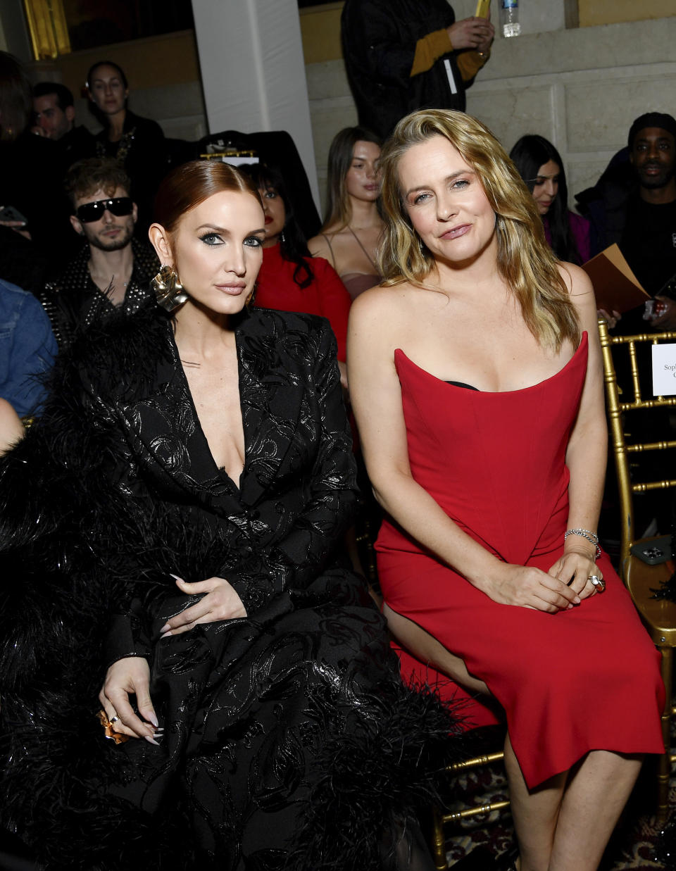 Ashlee Simpson, left, and Alicia Silverstone attend the Christian Siriano Fall/Winter 2024 fashion show at The Plaza Hotel during New York Fashion Week on Thursday, Feb. 8, 2024, in New York. (Photo by Evan Agostini/Invision/AP)