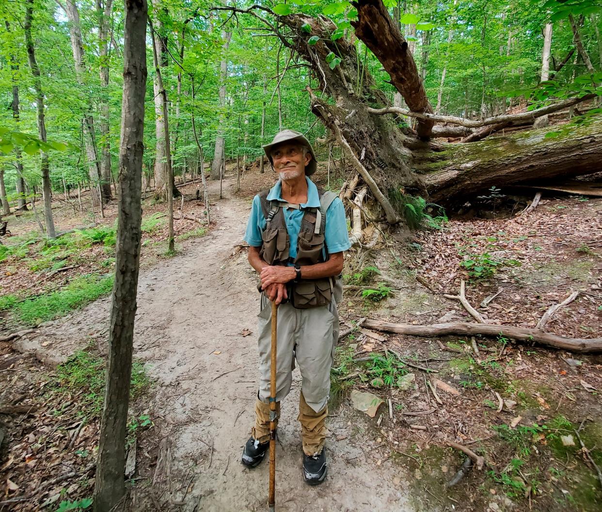 In this photo provided by Joe Villari, with the Virginia Outdoors Foundation, William H. “Marty” Martin poses for a picture at the Bull Run Mountains Preserve in Broad Run, Va., in July 2021. 