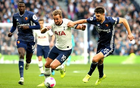 Tottenham Hotspur's Harry Kane (left) and Watford's Craig Cathcart (right) battle for the ball during the Premier League match at Tottenham Hotspur Stadium, London - Credit: PA