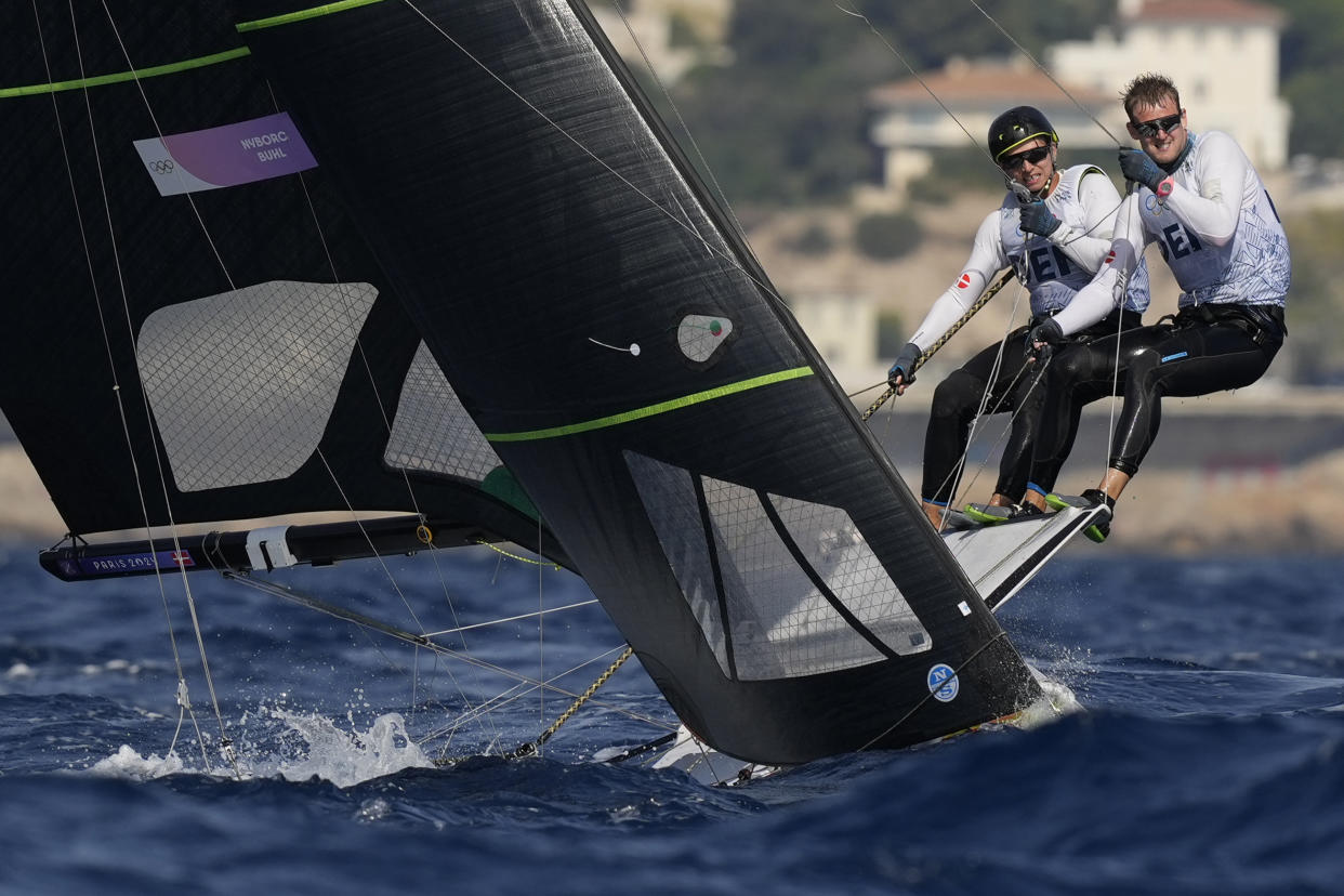 Nikolaj Buhl and Daniel Nyborg of Denmark sail to the mark during a men's 49er skiff class race during the 2024 Summer Olympics on July 30, 2024, in Marseille, France. (Carolyn Kaster/AP)