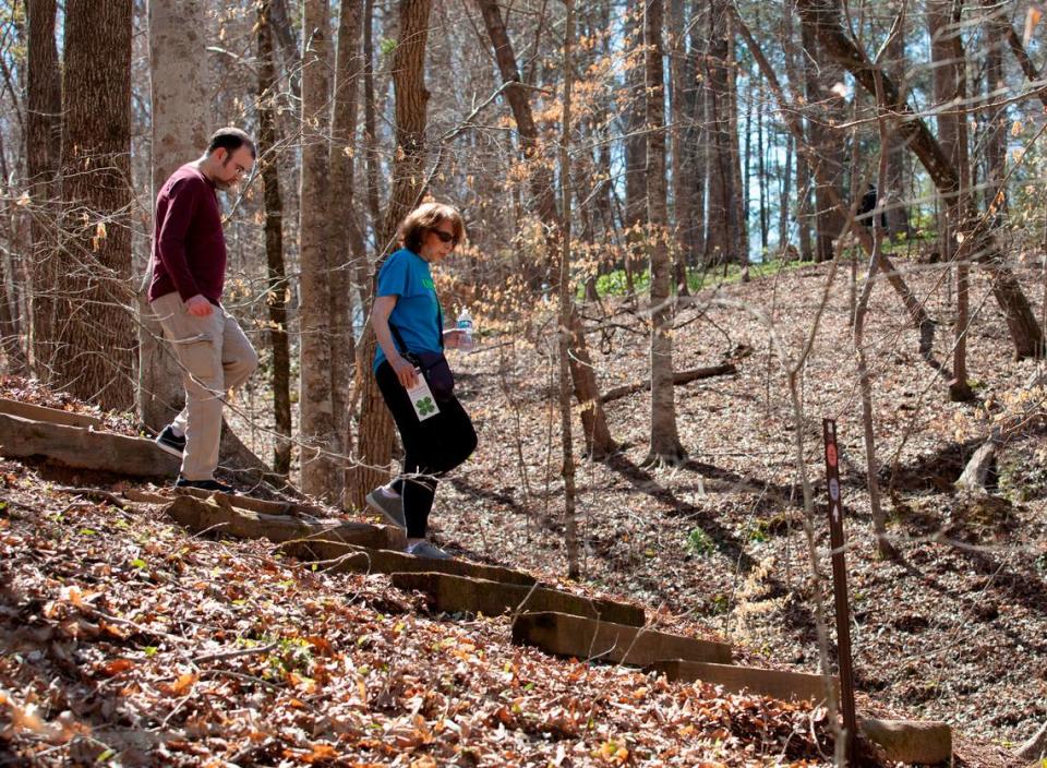 Carol Offen and her son, Paul Offen, walk on a trail in the North Carolina Botanical Garden on Wednesday, March 13, 2024, in Chapel Hill, N.C. Carol, who gave Paul a kidney 17 years ago, now advocates for legislation that would offer better protections for live donors.
