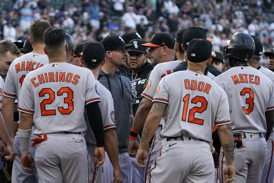 Baltimore Orioles and Chicago White Sox team members exchange words after Baltimore Orioles' Jorge Mateo was hit by pitch from Chicago White Sox starter Michael Kopech during the second inning of a baseball game in Chicago, Friday, June 24, 2022. (AP Photo/Nam Y. Huh)