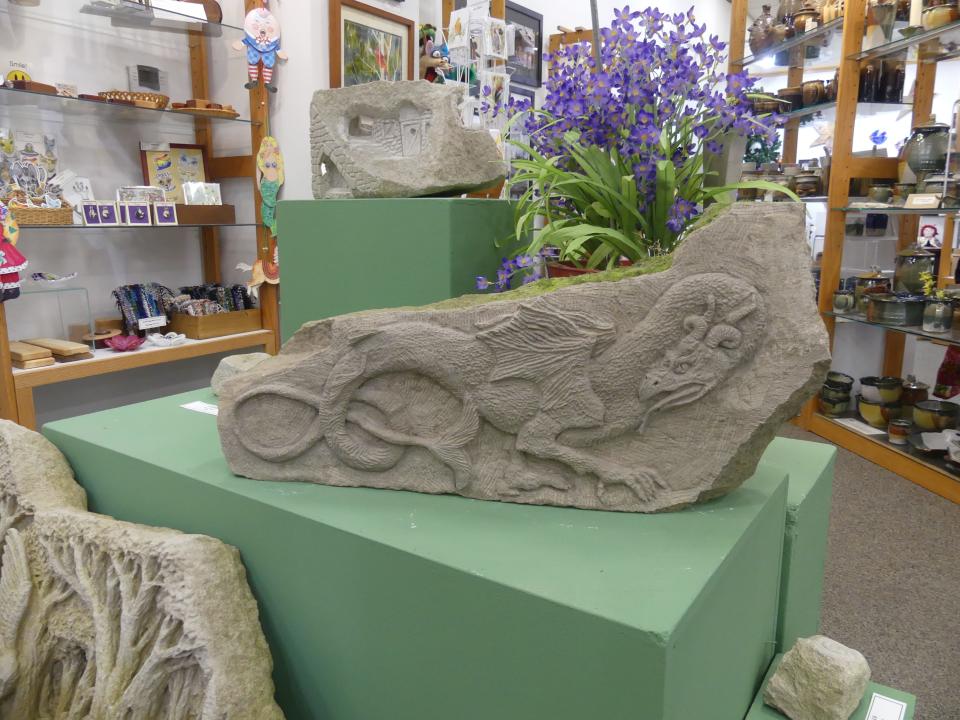A large hand-carved limestone sculpture crafted by local artist Sydney Bolam is for sale at By Hand Gallery.