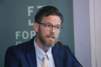Co-founder and Chief Executive Officer of Fortify Rights Matthew Smith talks to reporters during a news conference in Bangkok, Thailand, Tuesday, Jan. 24, 2023. The human rights group and 16 people from Myanmar have filed a criminal complaint in Germany seeking punishment of Myanmar's generals for genocide, war crimes and crimes against humanity they alleged were committed in that country after their 2021 government takeover and during a 2017 crackdown on Muslim Rohingya. (AP Photo/Sakchai Lalit)