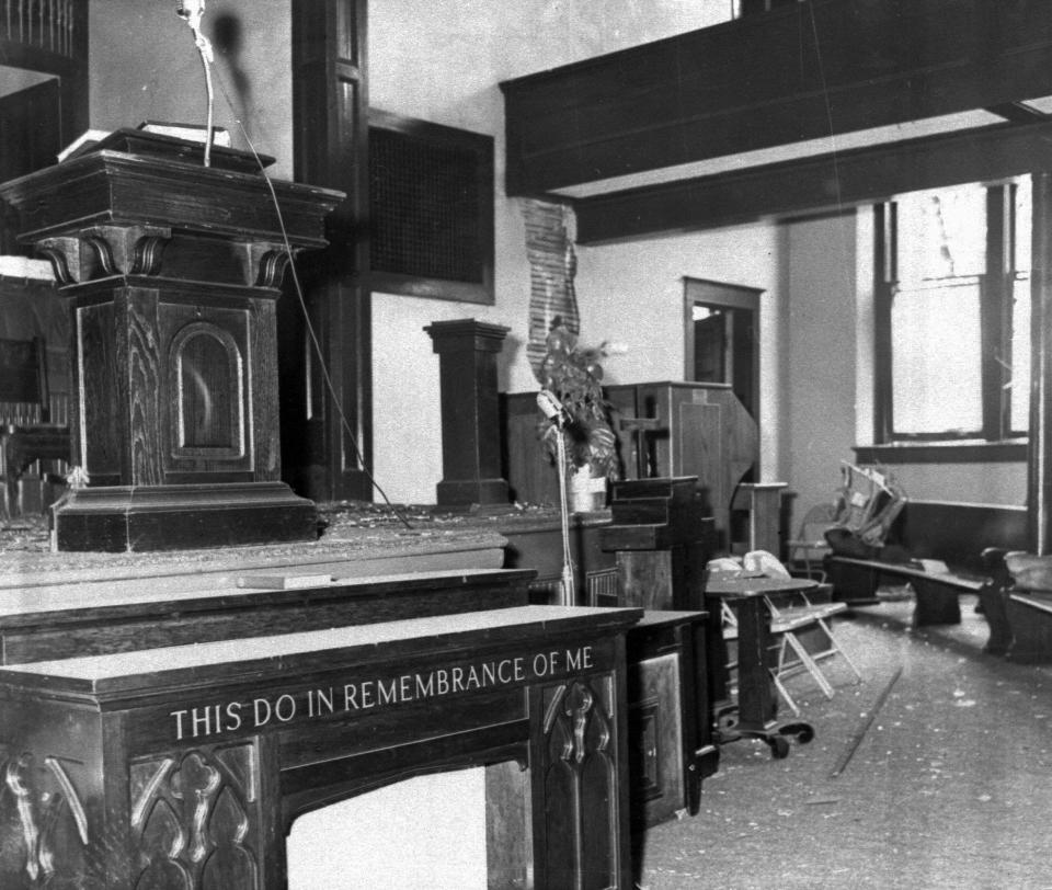 The altar of the Sixteenth Street Baptist Church is littered with glass and debris after a bomb ripped through the building in Birmingham, Ala., Sept.15, 1963. Windows at right were blown out by the blast. Four black girls were killed in the explosion. 