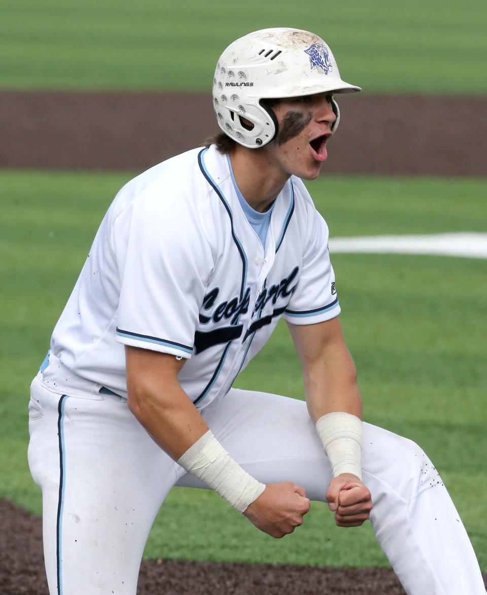 JT Popick of Louisville celebrates after stealing third base during their DII regional semifinal against University School at Thurman Munson Memorial Stadium on Thursday, June 2, 2022.