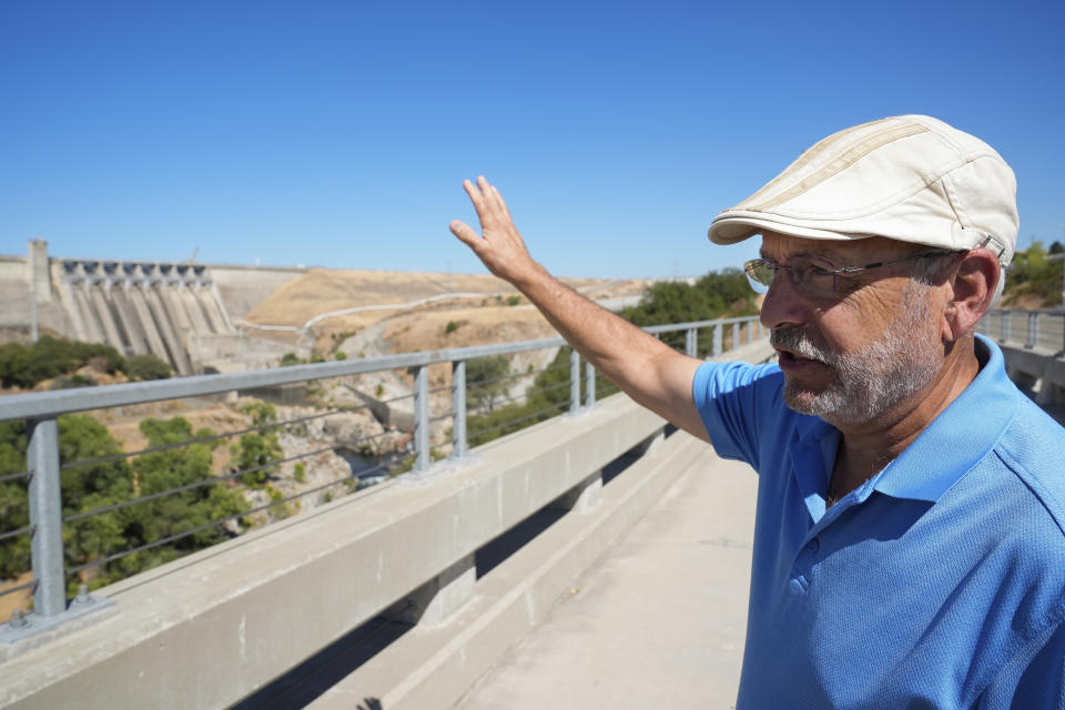 George Booth talks about the Folsom Dam, Friday, Aug. 16, 2024, in Folsom, Calif. (AP Photo/Godofredo A. Vásquez)