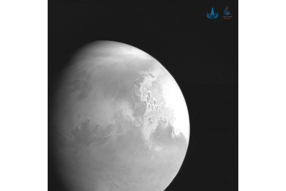 In this undated photo released by the China National Space Administration, a view of the planet Mars is captured by China's Tianwen-1 Mars probe from a distance of 2.2 million kilometers (1.37 million miles). A Chinese spacecraft appears poised to enter orbit around Mars on Wednesday, Feb. 10, 2021, one day after an orbiter from the United Arab Emirates did so, and about a week ahead of an American attempt to put down another spacecraft on the surface of the red planet. (CNSA/Xinhua via AP)