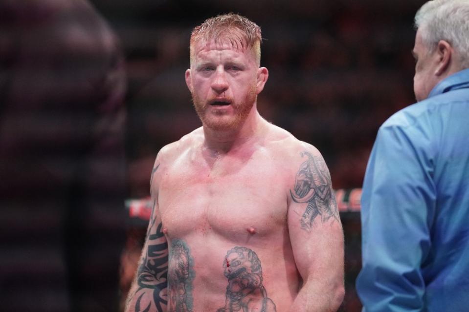 Apr 15, 2023; Kansas City, Missouri, USA; Ed Herman (blue gloves) reacts after the fight against Zak Cummings (red gloves) during UFC Fight Night at T-Mobile Center. Mandatory Credit: Denny Medley-USA TODAY Sports