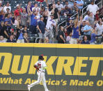 New York Mets fans cheer as Atlanta Braves outfielder Marcell Ozuna watches a two-run home run by Mets' Jonathan Villar during the third inning of a baseball game Tuesday, May 18, 2021, in Atlanta. (Curtis Compton/Atlanta Journal-Constitution via AP)