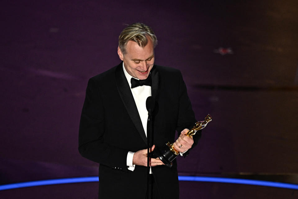 British director Christopher Nolan accepts the award for Best Director for 