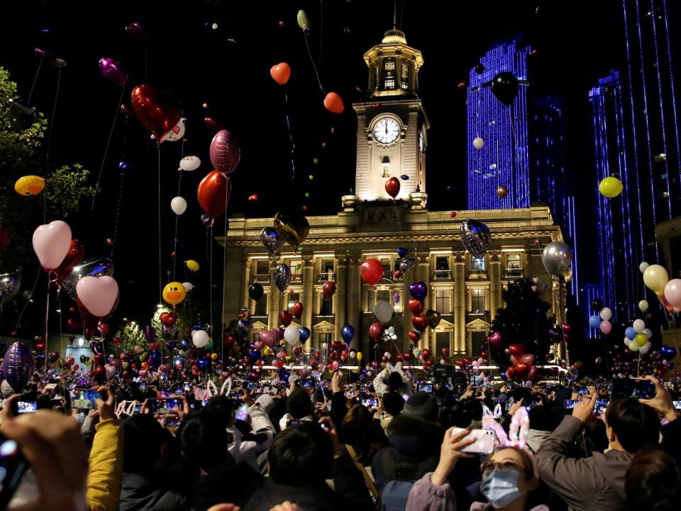 People celebrate the arrival of the new year in Wuhan, China. December 31, 2021.