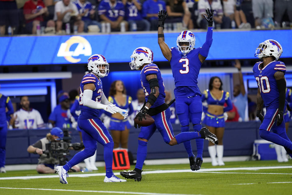 Buffalo Bills safety Jordan Poyer, center with ball, celebrates with teammates after intercepting a pass during the second half of an NFL football game against the Los Angeles Rams Thursday, Sept. 8, 2022, in Inglewood, Calif. (AP Photo/Ashley Landis)