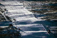 Fresh snow covers the Afriski ski resort near Butha-Buthe, Lesotho, Sunday July 31, 2022. While millions across Europe sweat through a summer of record-breaking heat, Afriski in the Maluti Mountains is Africa's only operating ski resort south of the equator. It draws people from neighboring South Africa and further afield by offering a unique experience to go skiing in southern Africa. (AP Photo/Jerome Delay)