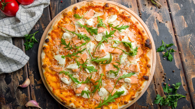 Salmon pizza on a table