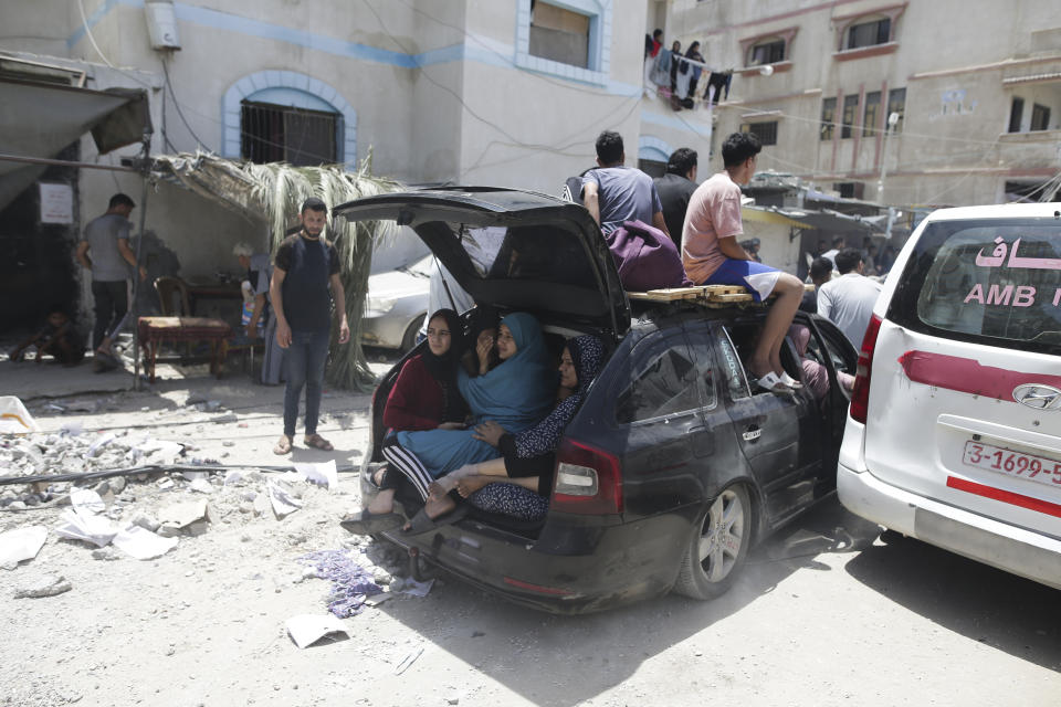 Palestinians evacuate dead and wounded in the Israeli bombardment of the Gaza Strip in Deir al Balah on Saturday, June 8, 2024. (AP Photo/Jehad Alshrafi)