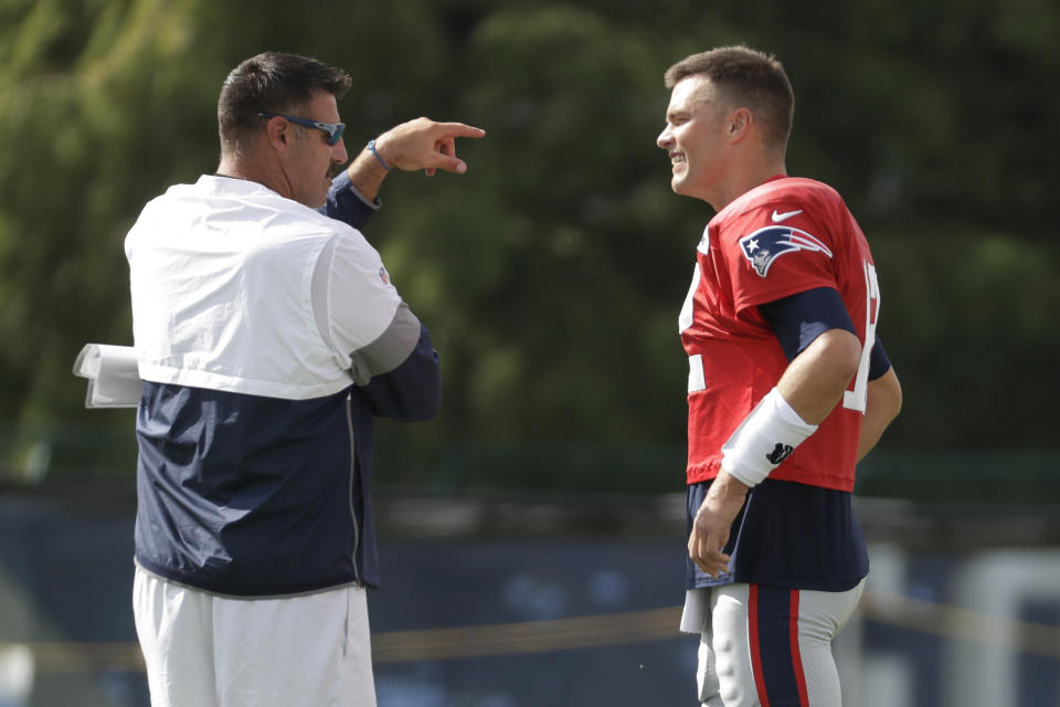 Tennessee Titans head coach Mike Vrabel talks with former New England Patriots teammate Tom Brady during a joint practice on Wednesday. (AP)